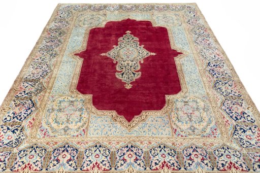 Surface texture of 2000s Kerman rug with natural Wool and intricate pattern