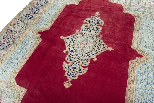 Backside of handmade 2000s Kerman rug showing knot structure and weave density