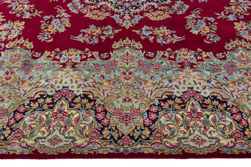 Corner detail of 2000s Kerman rug showing border pattern and Wool pile