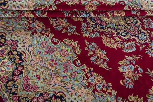 Close-up detail of 2000s Kerman rug from Iran / Persia showing Wool weave