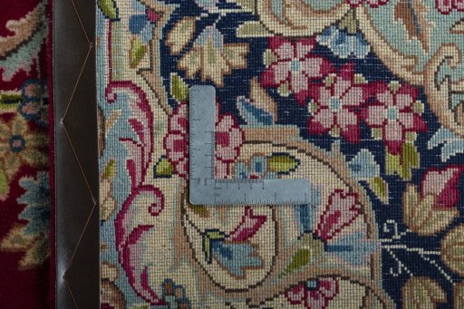 Backside of handmade 2000s Kerman rug showing knot structure and weave density
