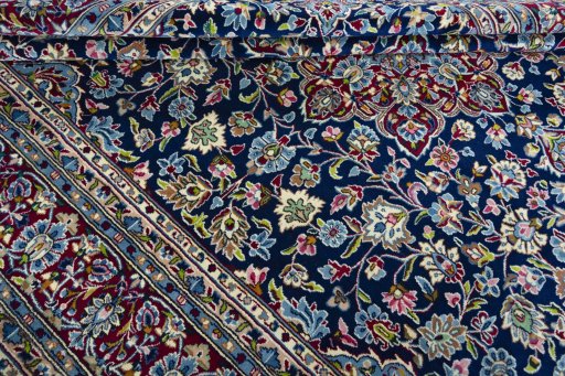 Close-up detail of 2000s Kerman rug from Iran / Persia showing Wool weave