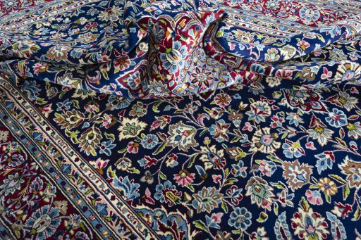 Surface texture of 2000s Kerman rug with natural Wool and intricate pattern