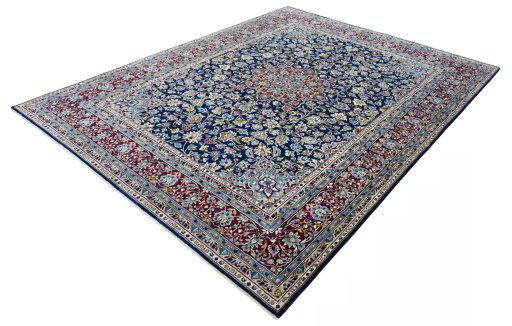 Corner detail of 2000s Kerman rug showing border pattern and Wool pile