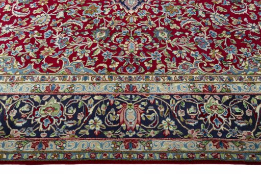 Corner detail of 2000s Kerman rug showing border pattern and Wool pile