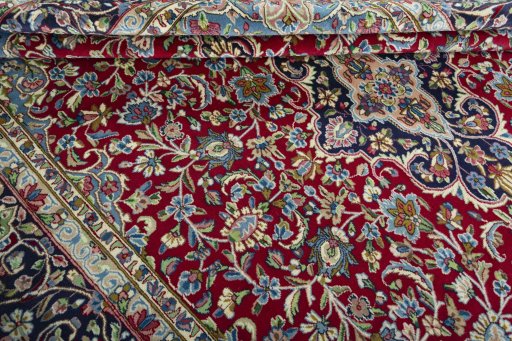 Close-up detail of 2000s Kerman rug from Iran / Persia showing Wool weave