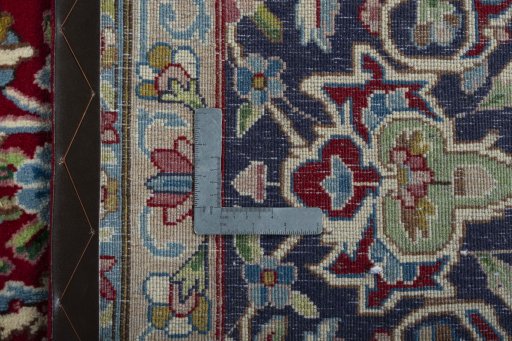 Backside of handmade 2000s Kerman rug showing knot structure and weave density