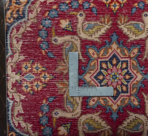 Backside of handmade 2000s Kerman rug showing knot structure and weave density