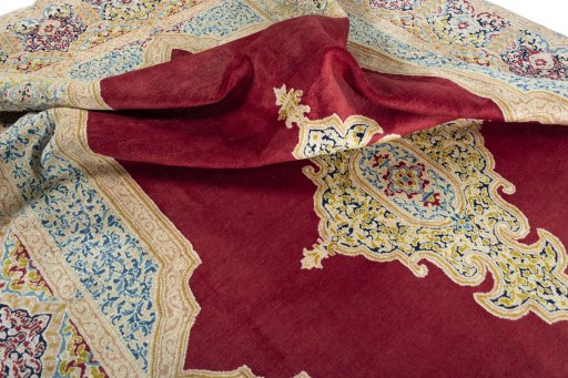 Surface texture of 2000s Kerman rug with natural Wool and intricate pattern