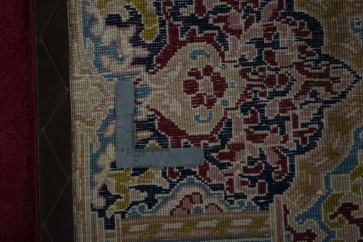 Backside of handmade 2000s Kerman rug showing knot structure and weave density