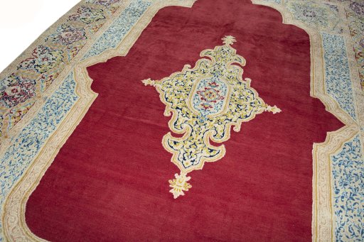 Backside of handmade 2000s Kerman rug showing knot structure and weave density