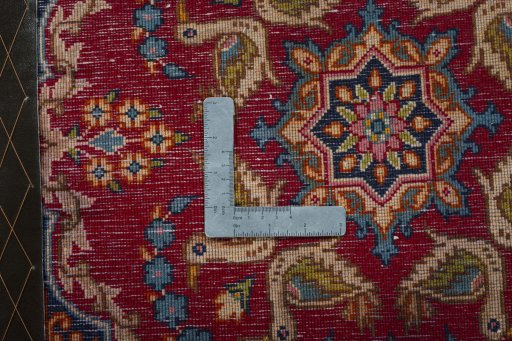 Backside of handmade 2000s Kerman rug showing knot structure and weave density