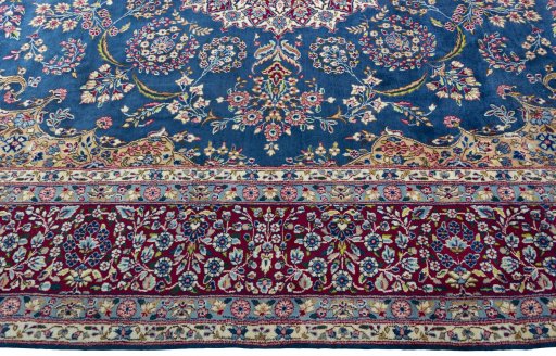 Corner detail of New Kerman rug showing border pattern and Wool pile
