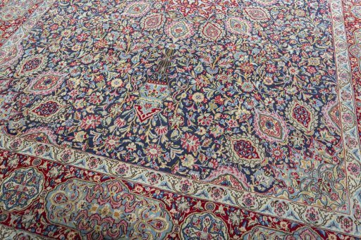 Close-up detail of 2000s Kerman rug from Iran / Persia showing Wool weave