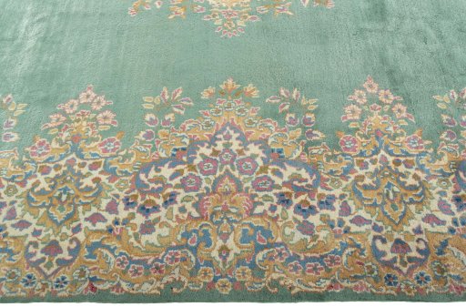 Corner detail of 2000s Kerman rug showing border pattern and Wool pile