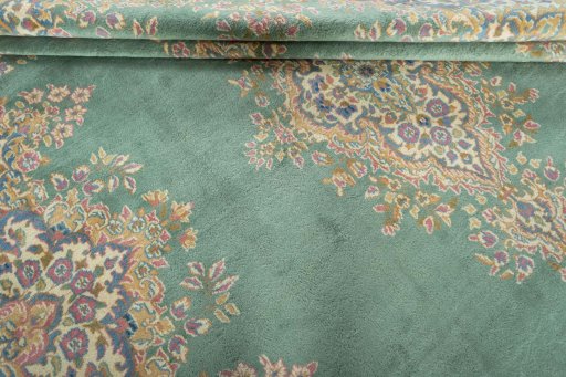 Close-up detail of 2000s Kerman rug from Iran / Persia showing Wool weave