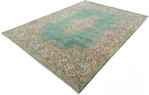 Corner detail of 2000s Kerman rug showing border pattern and Wool pile