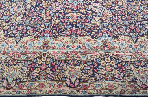 Corner detail of 1970s Kerman rug showing border pattern and Wool pile