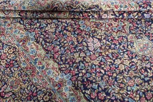 Close-up detail of 1970s Kerman rug from Iran / Persia showing Wool weave
