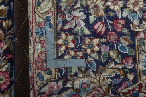Backside of handmade 1970s Kerman rug showing knot structure and weave density