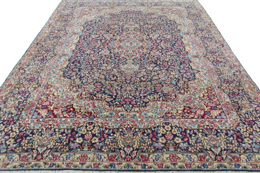 Surface texture of 1970s Kerman rug with natural Wool and intricate pattern