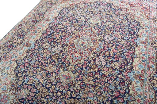 Backside of handmade 1970s Kerman rug showing knot structure and weave density