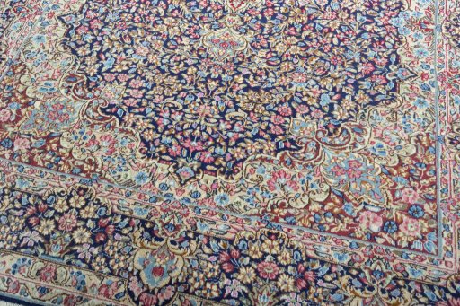 Close-up detail of 1970s Kerman rug from Iran / Persia showing Wool weave
