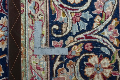 Backside of handmade 2000s Kerman rug showing knot structure and weave density