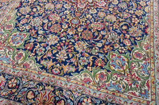 Close-up detail of 2000s Kerman rug from Iran / Persia showing Wool weave