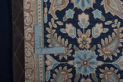 Backside of handmade 2000s Kerman rug showing knot structure and weave density