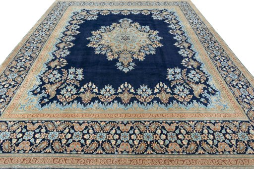 Surface texture of 2000s Kerman rug with natural Wool and intricate pattern