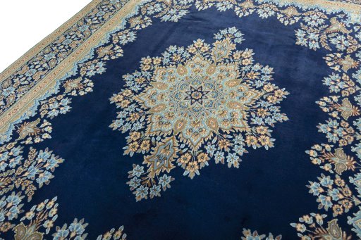 Backside of handmade 2000s Kerman rug showing knot structure and weave density