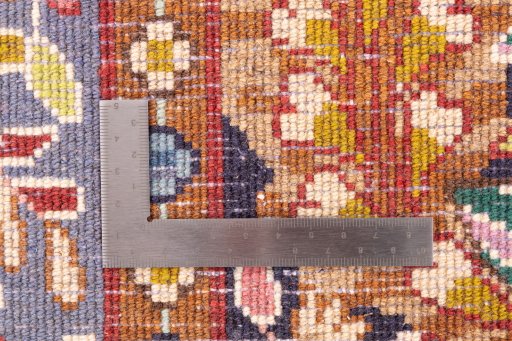 Corner detail of 1980s Kerman rug showing border pattern and Wool pile