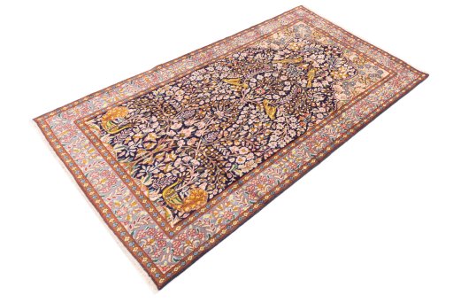 Close-up detail of 1980s Kerman rug from Iran / Persia showing Wool weave