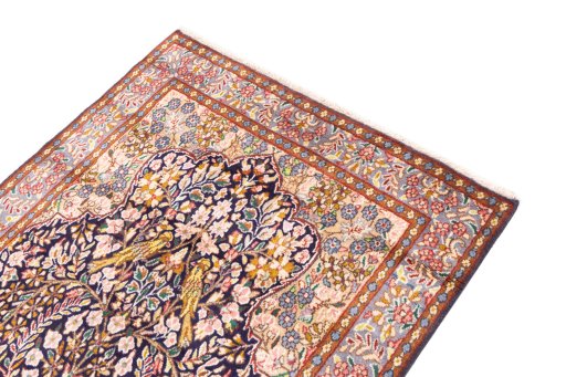 Surface texture of 1980s Kerman rug with natural Wool and intricate pattern