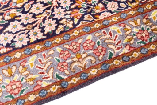 Backside of handmade 1980s Kerman rug showing knot structure and weave density