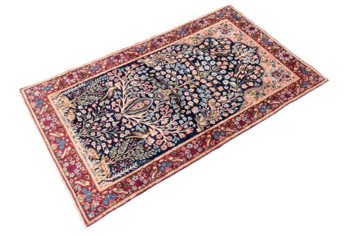 Close-up detail of 1970s Kerman rug from Iran / Persia showing Wool weave