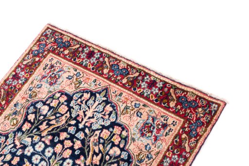 Surface texture of 1970s Kerman rug with natural Wool and intricate pattern