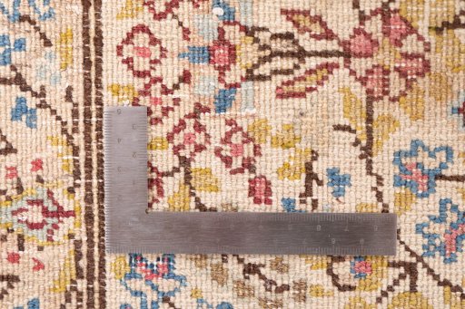 Close-up detail of 1980s Kerman rug from Iran / Persia showing Wool weave