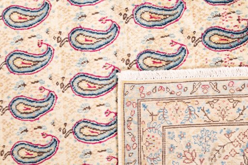 Close-up detail of 1980s Kerman rug from Iran / Persia showing Wool weave