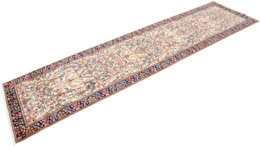 Corner detail of 2000s Kerman rug showing border pattern and Wool pile