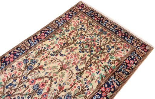 Surface texture of 2000s Kerman rug with natural Wool and intricate pattern