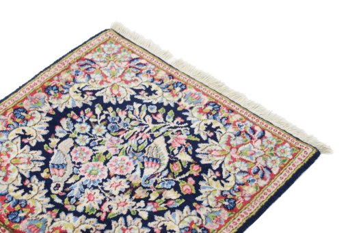 Surface texture of 1990s Kerman rug with natural Wool and intricate pattern