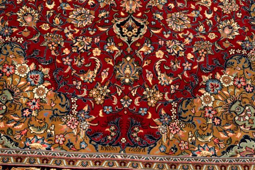 Corner detail of New Kerman rug showing border pattern and Wool pile