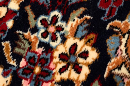Backside of handmade New Kerman rug showing knot structure and weave density