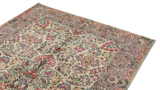 Surface texture of 1920s Kerman rug with natural Wool and intricate pattern
