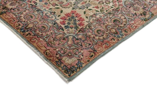 Backside of handmade 1920s Kerman rug showing knot structure and weave density