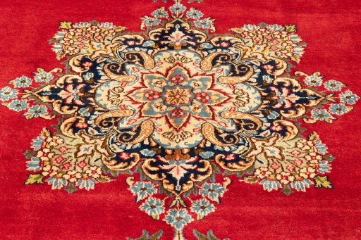 Corner detail of 1990s Kerman rug showing border pattern and Wool pile