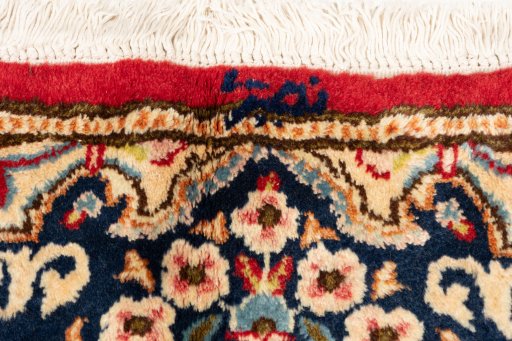 Close-up detail of 1990s Kerman rug from Iran / Persia showing Wool weave