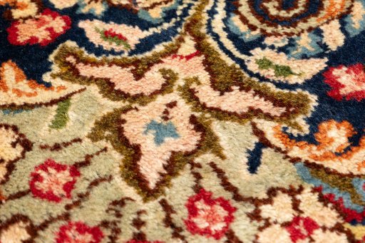Backside of handmade 1990s Kerman rug showing knot structure and weave density